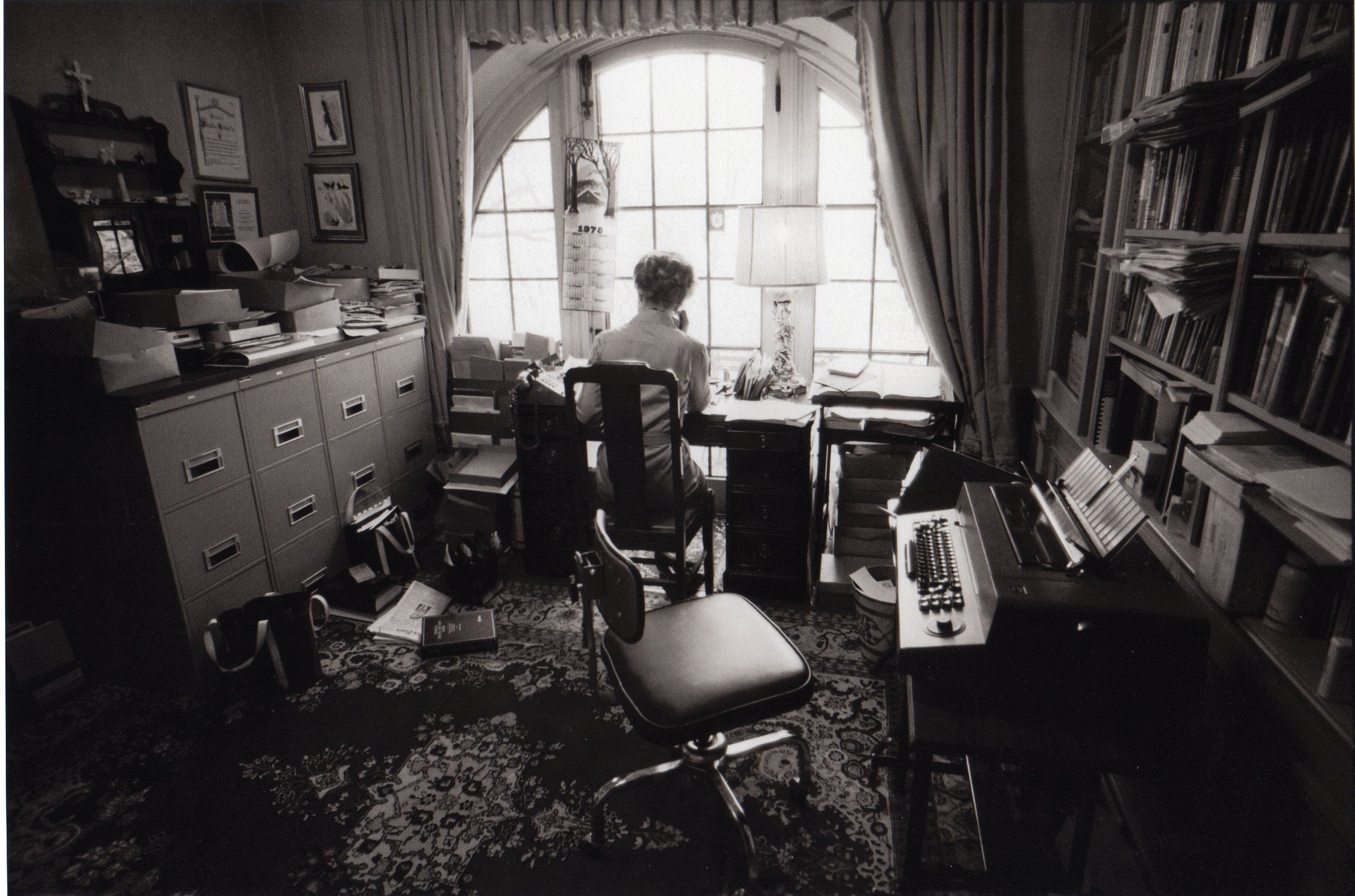 Phyllis Schlafly writing at her desk in Alton, Illinois in 1978