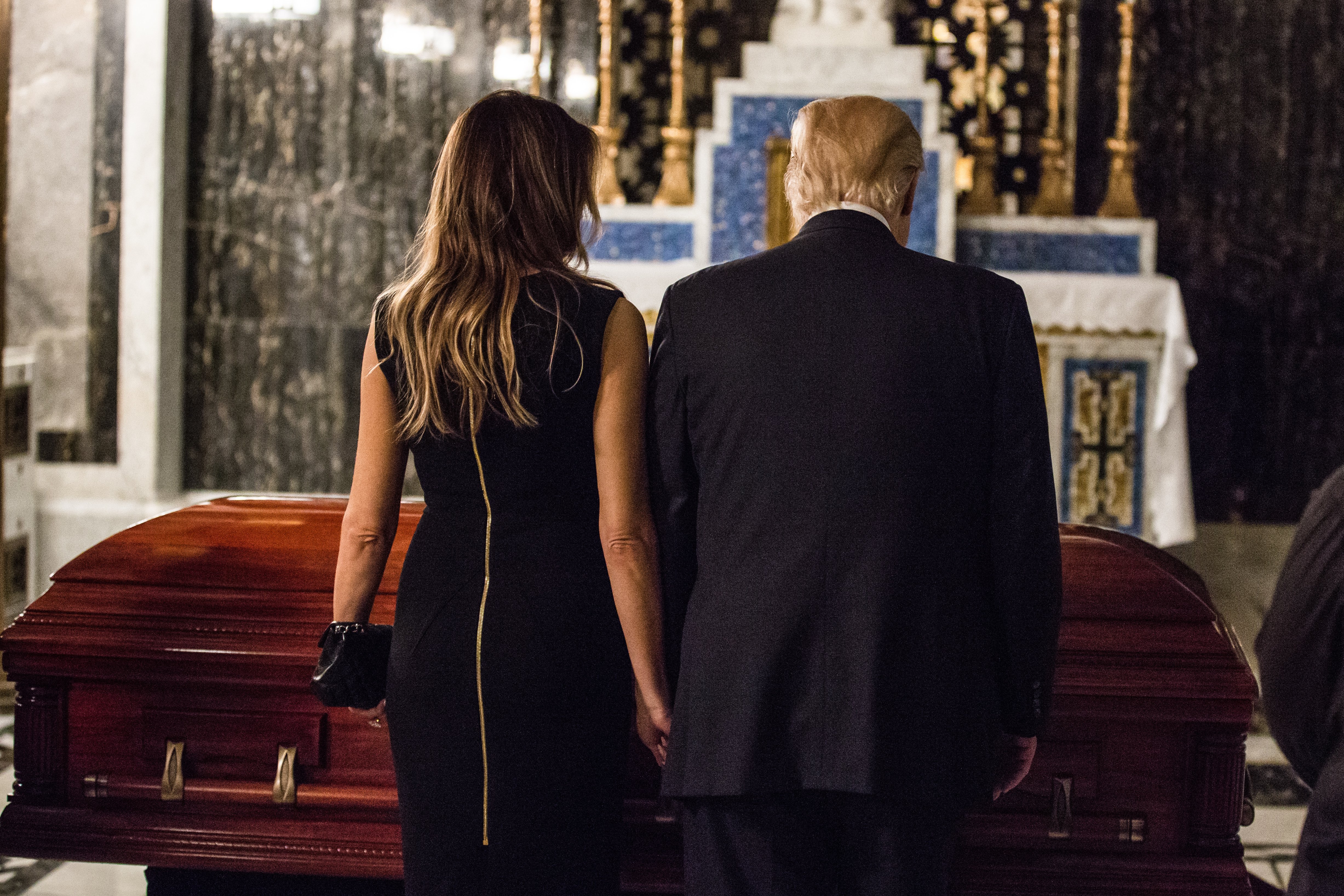 Donald and Melania Trump stand near Phyllis Schlafly’s casket