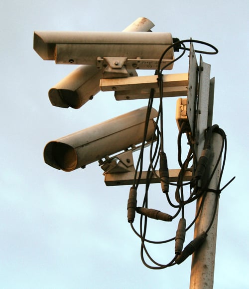 Several surveillance cameras mounted together